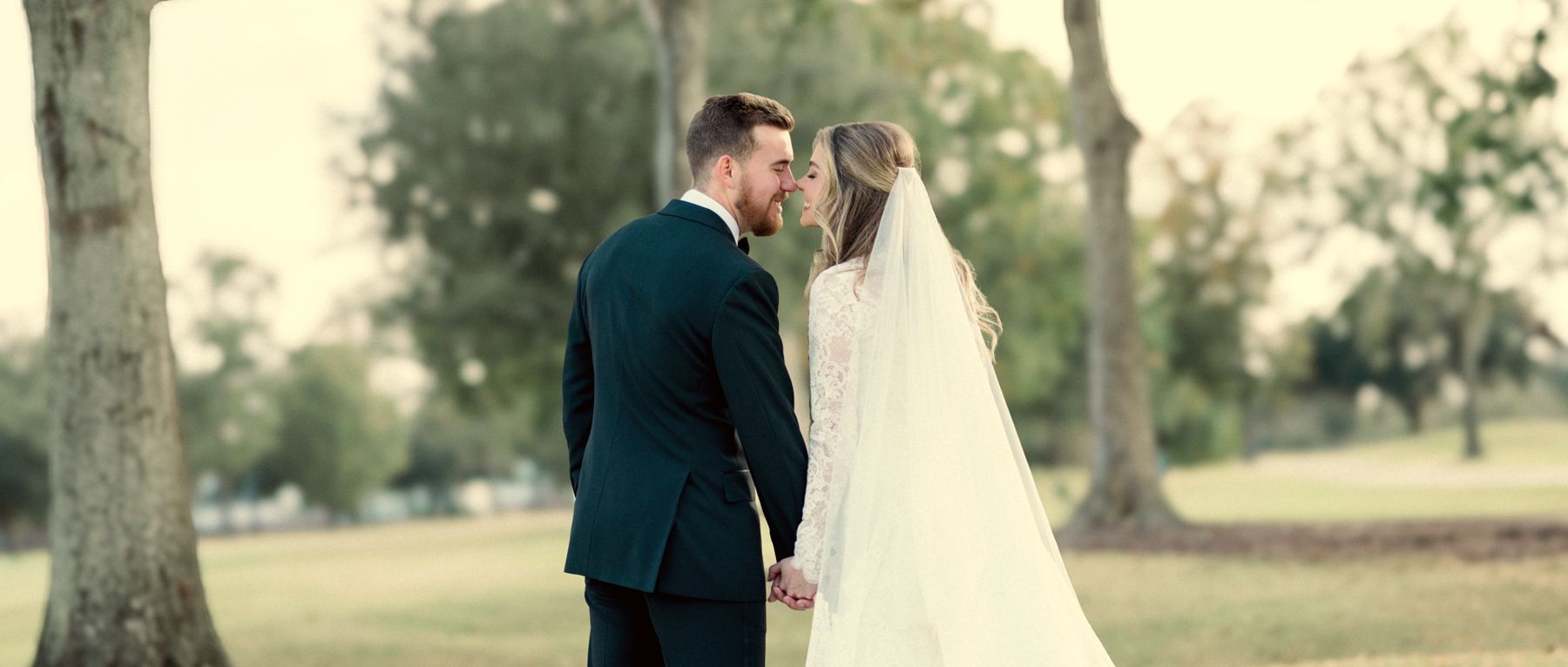 Couple under a long white colonnade
