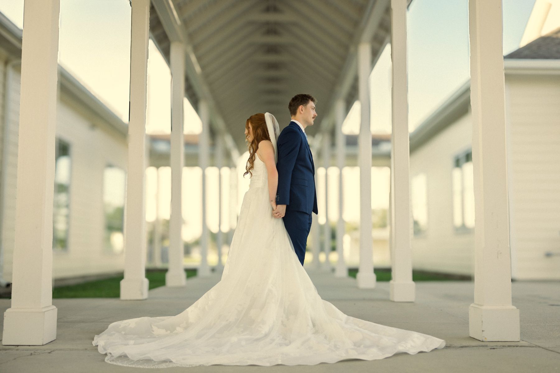 Holding hands, bouquet in view